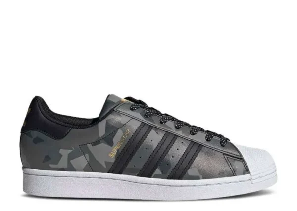 adidas-superstar-black-gold-camo.webp ADIDAS SUPERSTAR ‘BLACK GOLD CAMO’